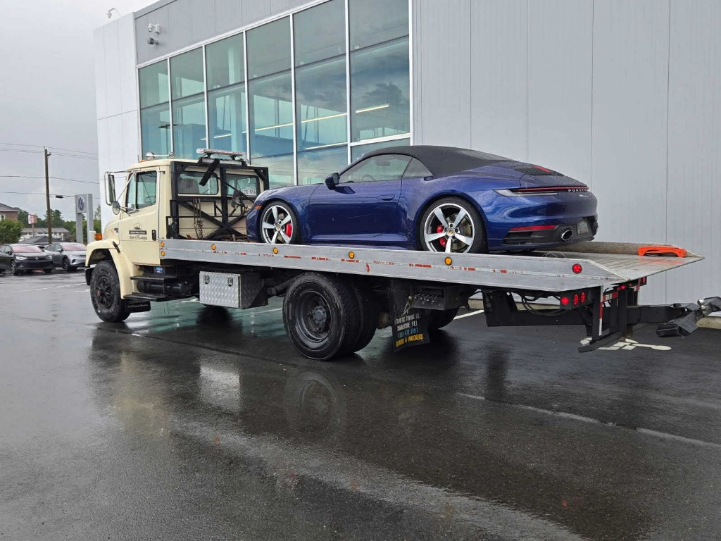 Blue Porsche 911 transport on flatbed