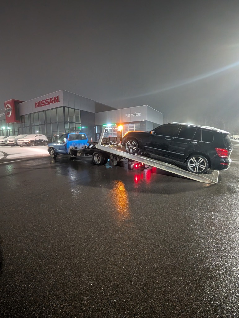 Black Mercedes SUV recovery at Nissan Dealership